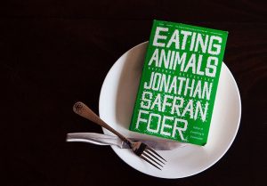 Eating Animals book on plate with silverware